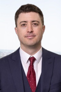 Professional headshot of attorney Clinton Oas