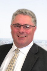 professional headshot of attorney Greg DuMont