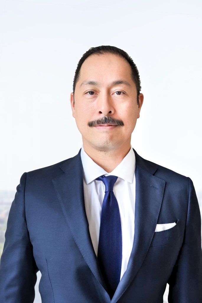 Professional headshot of attorney Noel Manalo