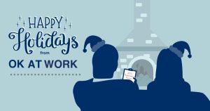 Happy Holidays from OK at Work card with silhouettes of Russell and Sarah sitting in front of a fireplace