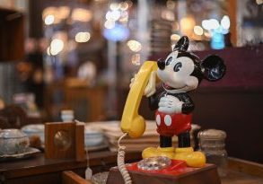 shallow focus of Mickey Mouse vintage rotary classic phone