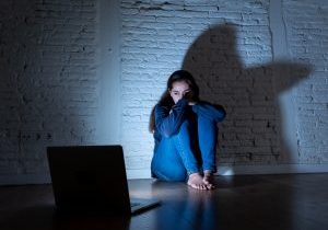 Sad,And,Scared,Female,Young,Woman,With,Computer,Laptop,Suffering
