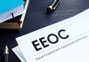 Equal Employment Opportunity Commission EEOC document and pen on a table.