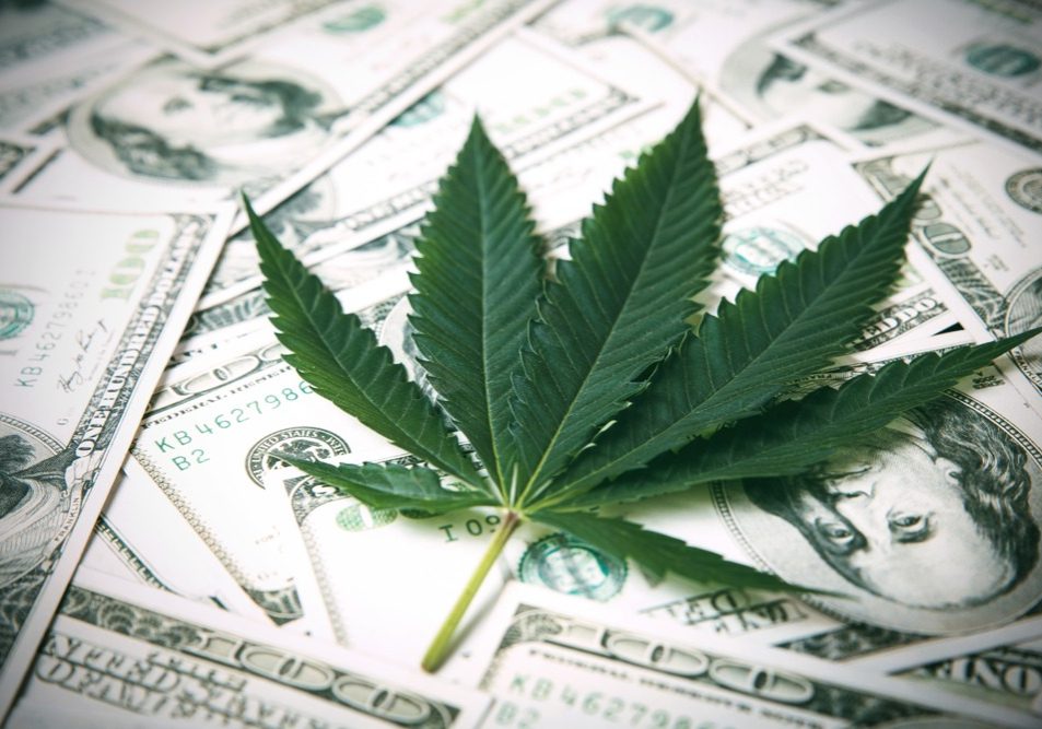 Marijuana Leaf and US Dollar Banknotes. Marijuana business concept. CBD Medical Marijuana Dollar THC Cannabis.