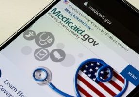 Closeup of the homepage of Medicaid.gov seen on a smartphone.