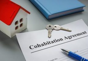 Cohabitation agreement, keys and model of home.