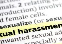 close up photo of the words sexual harassment highlighted on a page in the dictionary