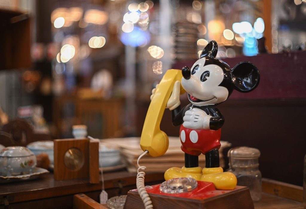 shallow focus of Mickey Mouse vintage rotary classic phone