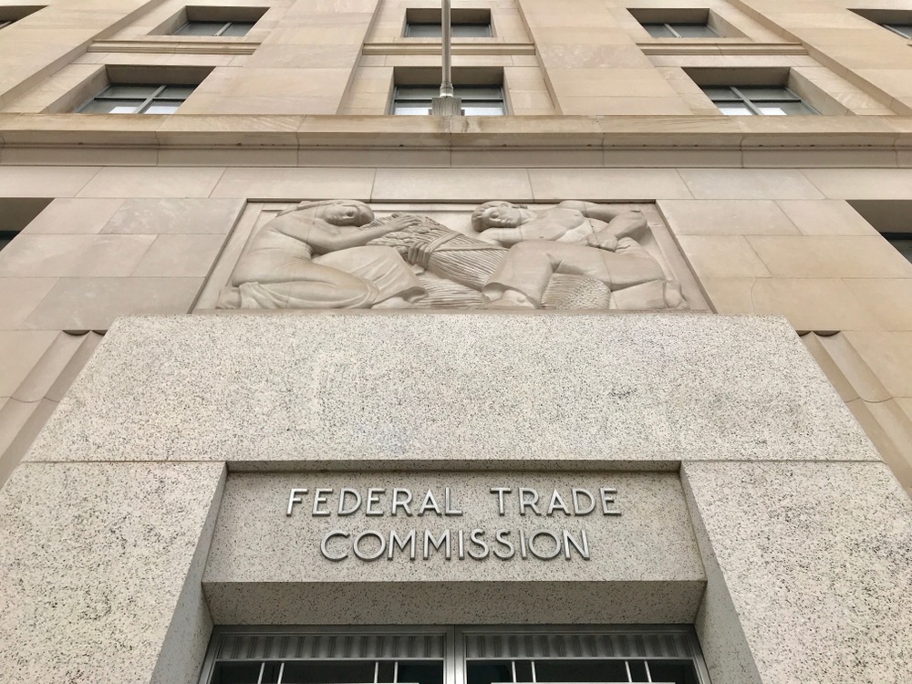 FTC FEDERAL TRADE COMMISSION headquarters building entrance with sign above door and exterior.