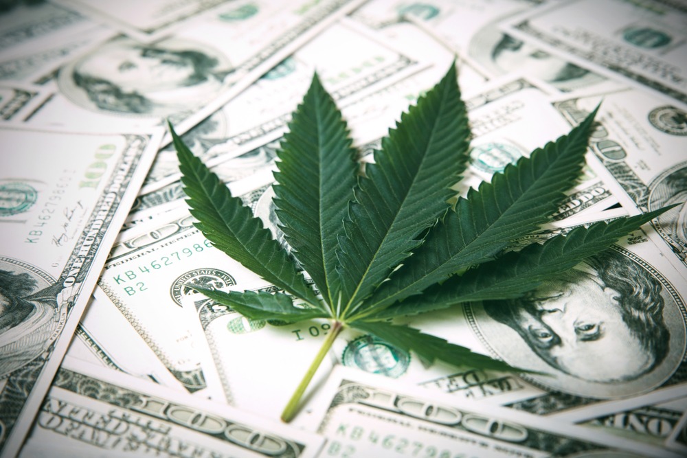Marijuana Leaf and US Dollar Banknotes. Marijuana business concept. CBD Medical Marijuana Dollar THC Cannabis.