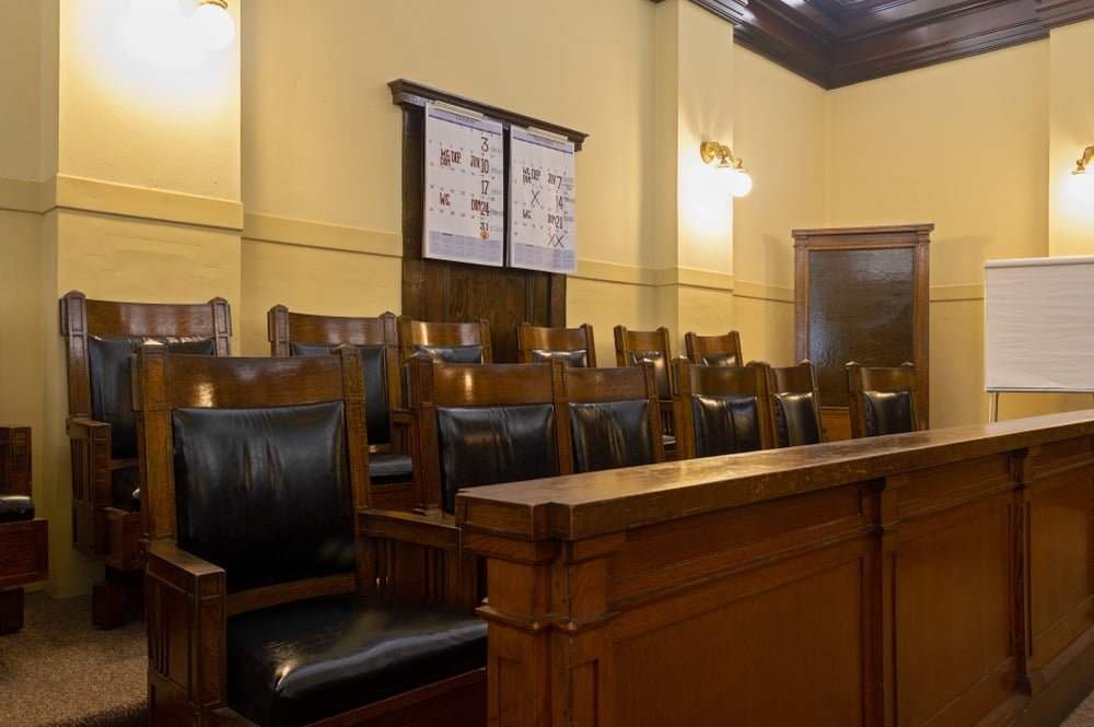 brown juror chairs inside a court room