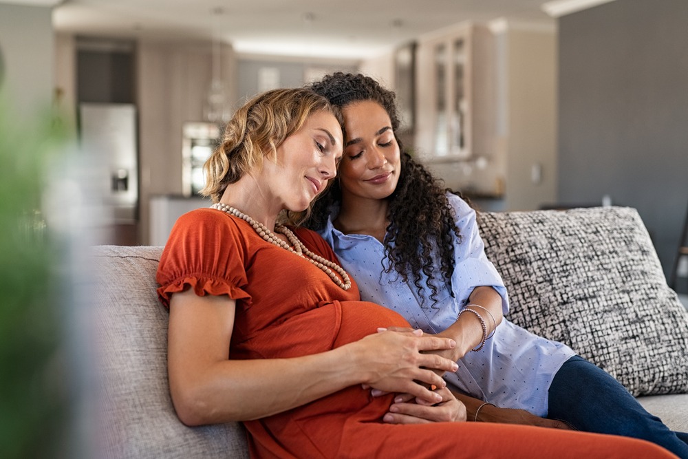 Multiethnic,Lesbian,Couple,With,Hands,On,Baby,Bump,Of,Pregnant