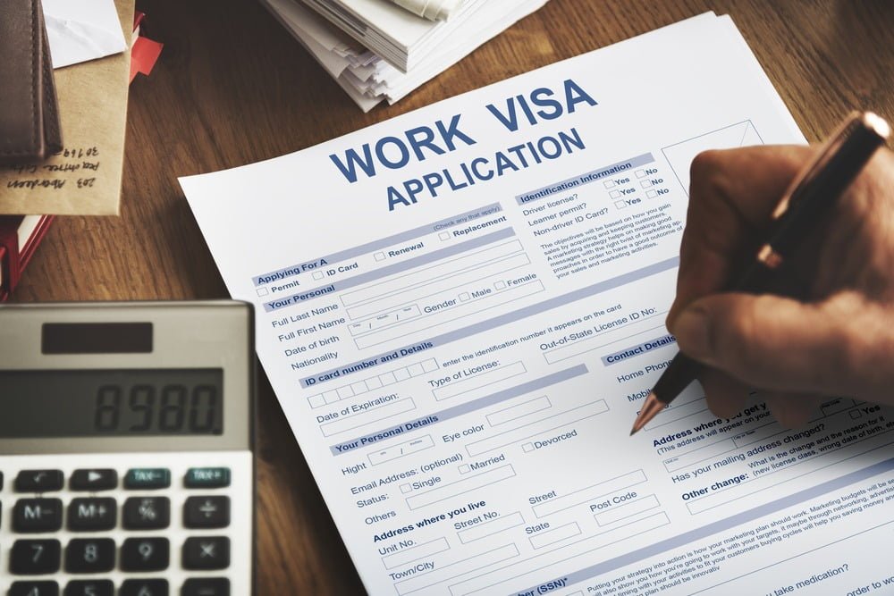 Man filling out a Work Visa Application