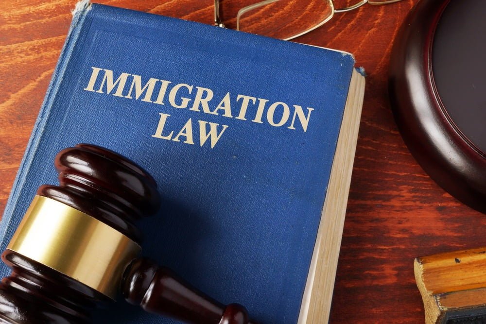 Book with title immigration law on a table